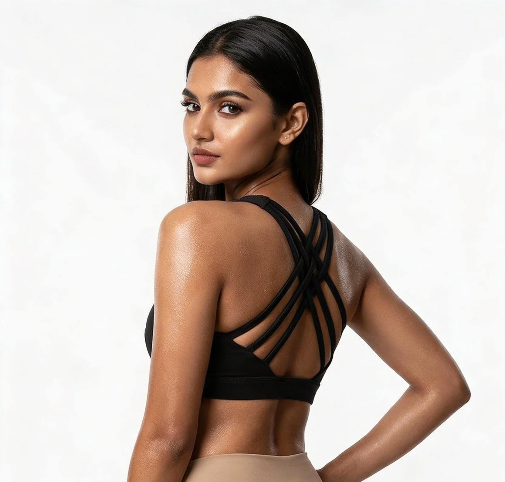 Model showing the strappy back design of a black VYB sports bra