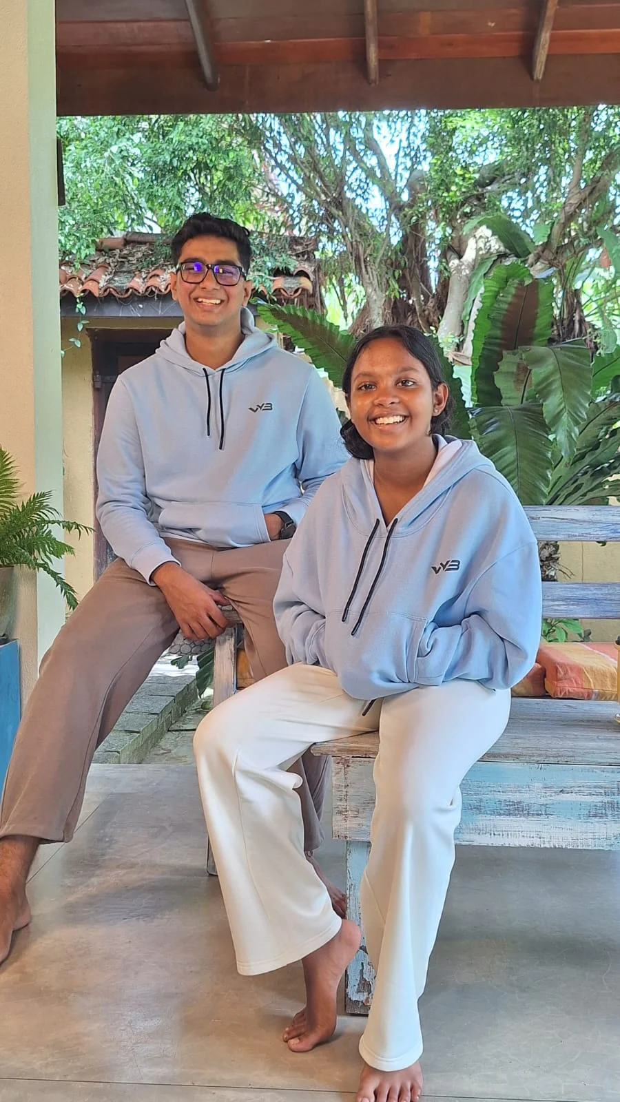 Two VYB models wearing coordinated light-blue hoodies and athleisure pants